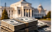 Stacks of dollar bills in front of a government building
